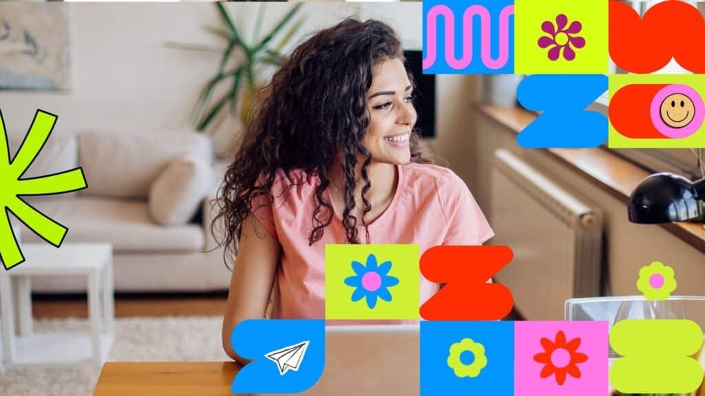 Woman drinking leisurely working on a laptop at a wooden desk.
